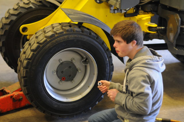 Young man working on a vehicle